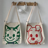 A fabulous mix of Japanese manga and American pop art styles, Japanese illustrator Osamu Harada created some of the most iconic kawaii designs of the 1980s. These Japanese Pop Art Cat Face Tote Bag by Osamu Goods feature his wholesome but edgy designs in a fabulous larger sized canvas tote with silkscreened happy cat face, one of his most famous iconic designs.